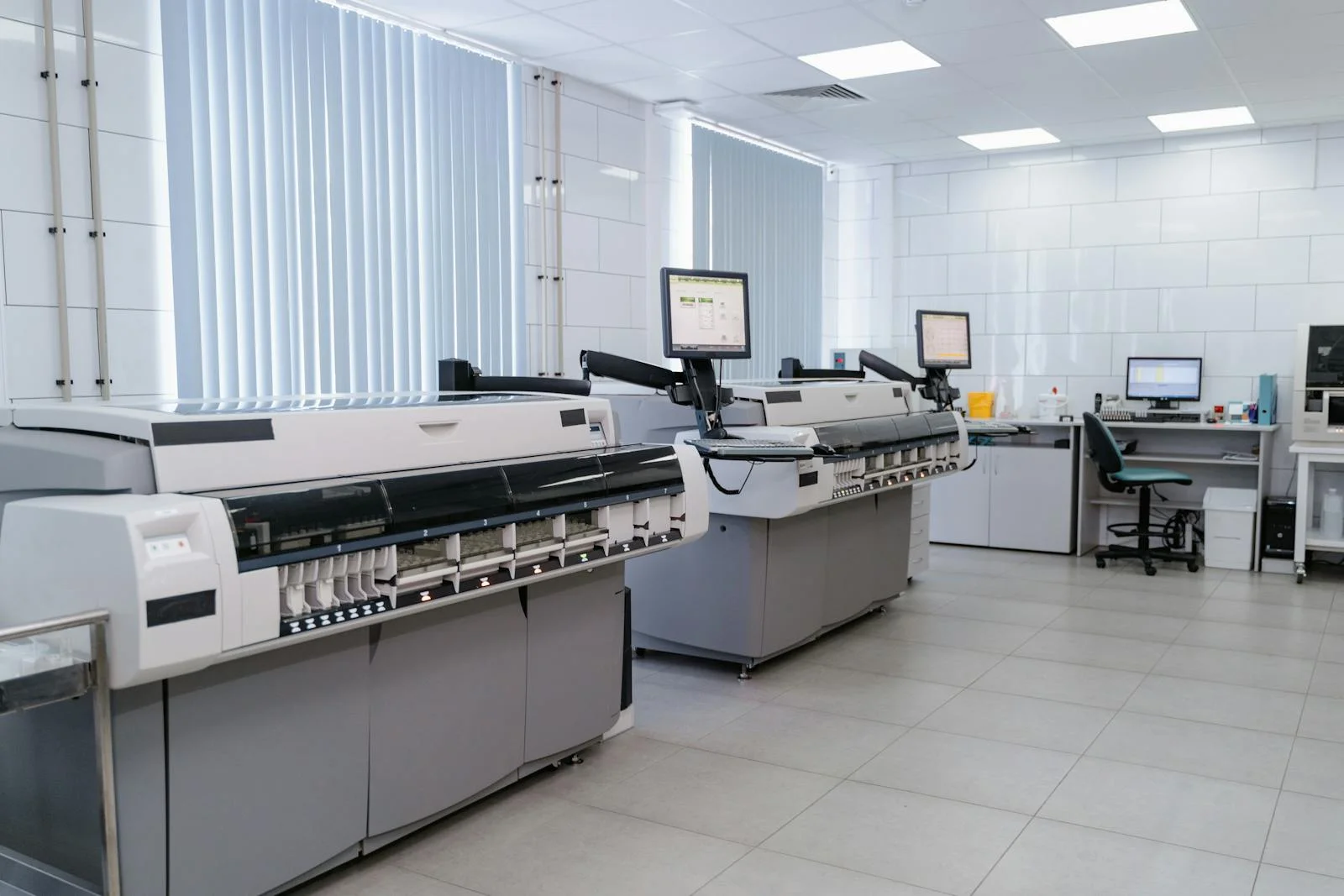 Spacious modern laboratory featuring advanced printing equipment and workstations. printing near me large-scale printing for business